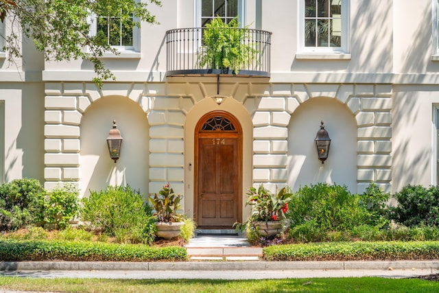 174 N Shelmore Blvd, Mount Pleasant, SC 29464 - doorway to property with a balcony and stucco siding