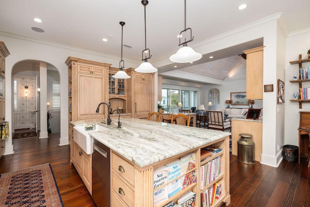 kitchen featuring pendant lighting, dishwasher, sink, ornamental molding, and a large island