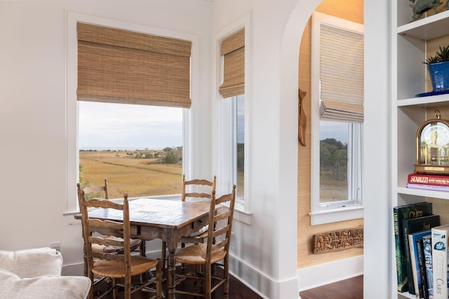 dining area featuring dark hardwood / wood-style floors