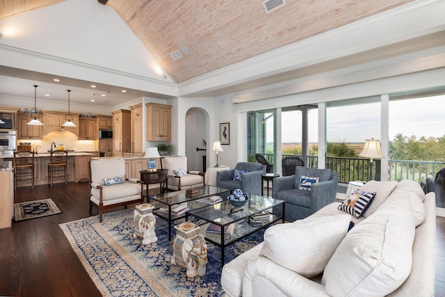 living room with dark hardwood / wood-style floors, wood ceiling, crown molding, and high vaulted ceiling