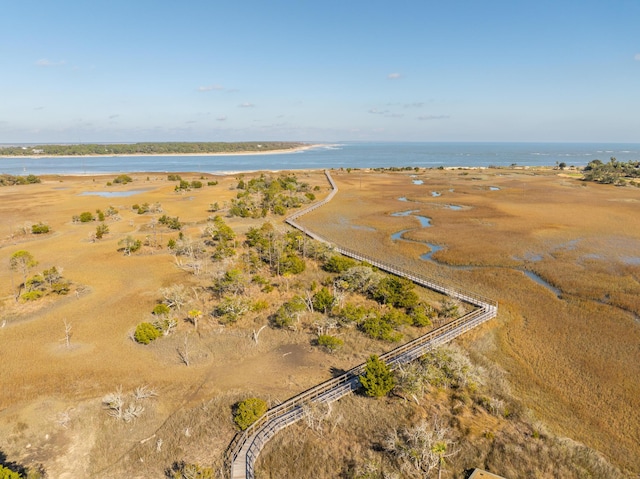 drone / aerial view with a rural view and a water view