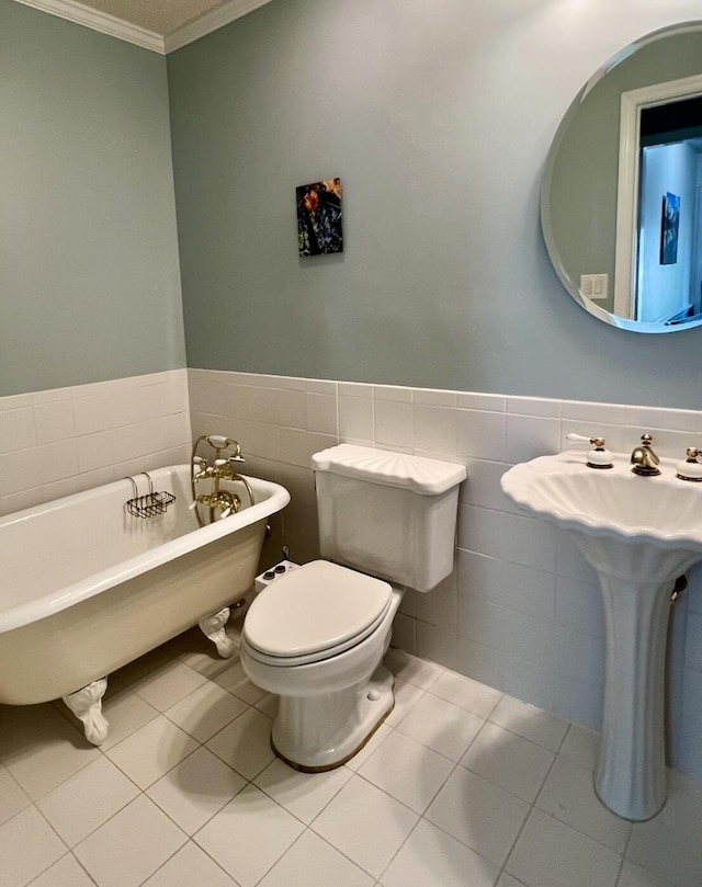 1039 Grand Concourse St, Charleston, SC 29412 - full bath with a soaking tub, crown molding, tile walls, tile patterned flooring, and wainscoting