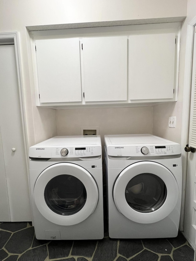 1039 Grand Concourse St, Charleston, SC 29412 - laundry area with tile patterned floors, cabinet space, and washer and dryer