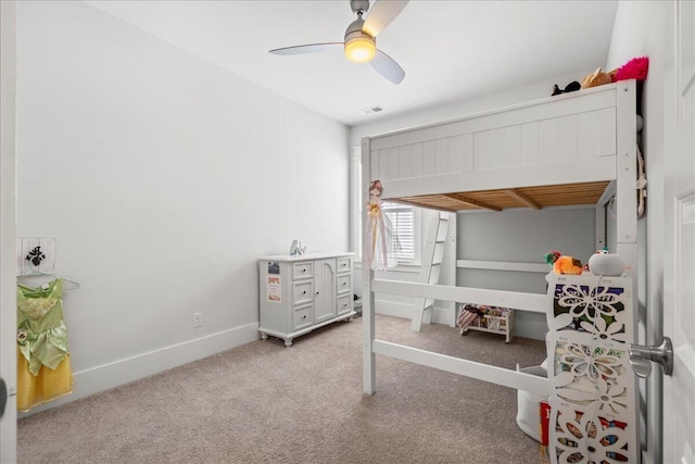 bedroom featuring light colored carpet and ceiling fan