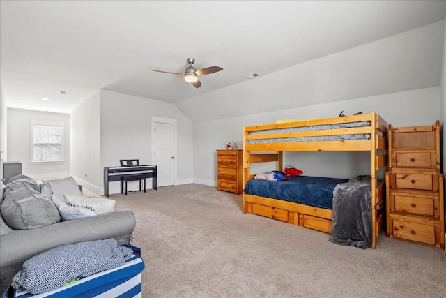 bedroom featuring lofted ceiling, carpet, and ceiling fan