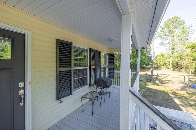 deck with a porch and area for grilling