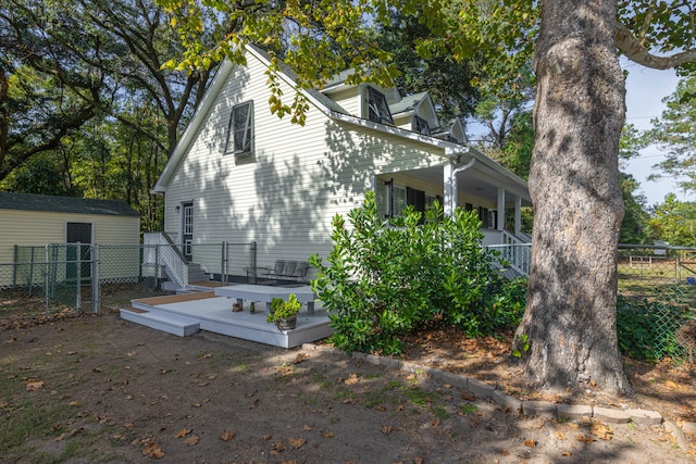 view of home's exterior with a wooden deck