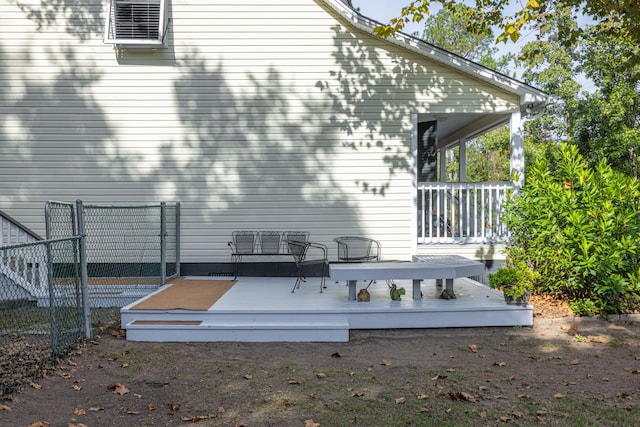 back of house featuring a deck