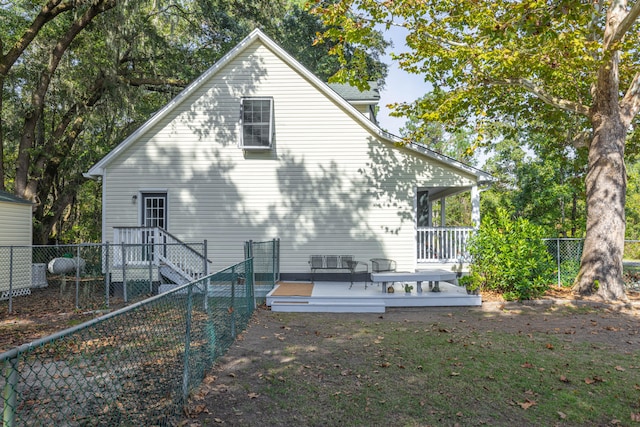 rear view of house with a wooden deck