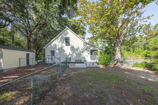 rear view of property with a deck