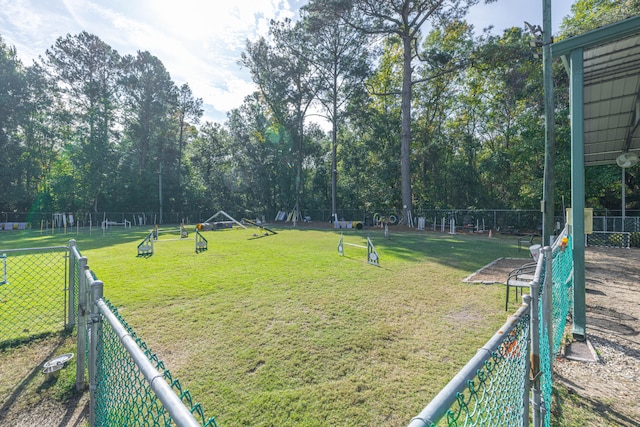 view of property's community with a yard