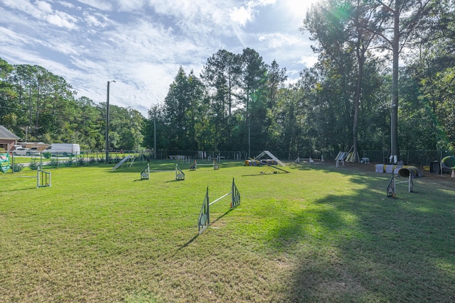 view of property's community with a yard