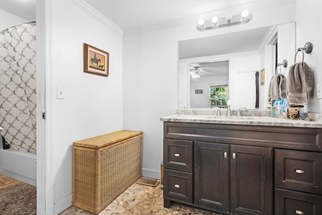 bathroom featuring ceiling fan, shower / bath combo with shower curtain, vanity, and ornamental molding