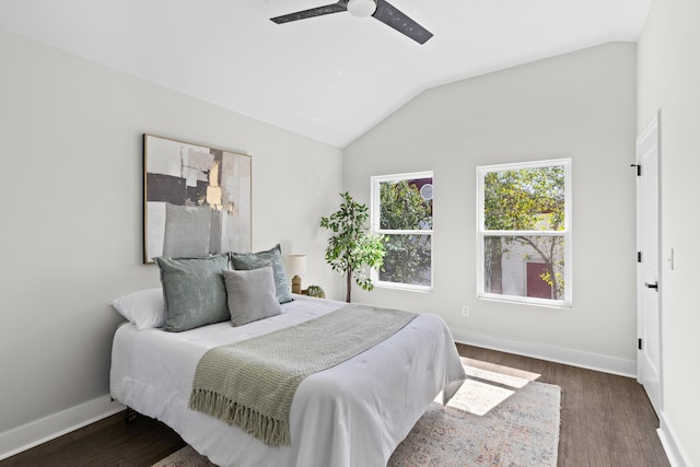 bedroom featuring vaulted ceiling, ceiling fan, wood finished floors, and baseboards