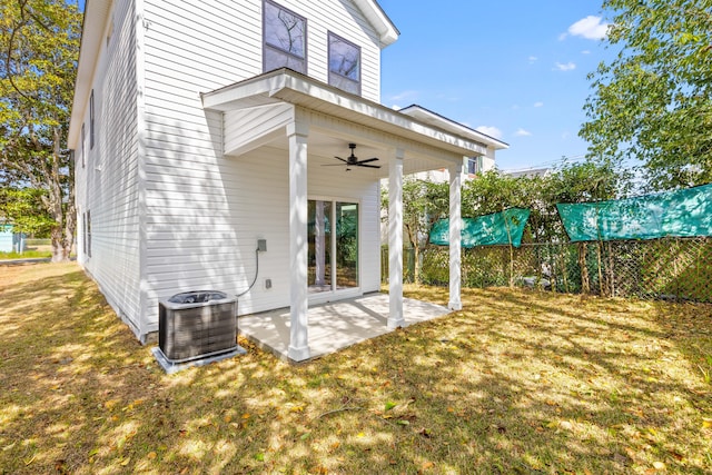 rear view of house featuring a patio, cooling unit, fence, a ceiling fan, and a yard