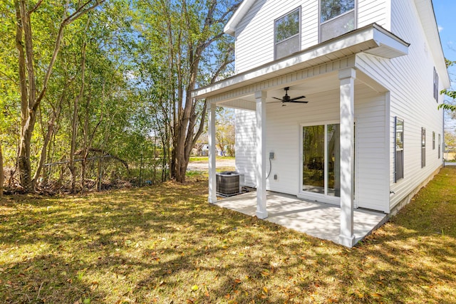 view of yard featuring a patio, a ceiling fan, and central air condition unit