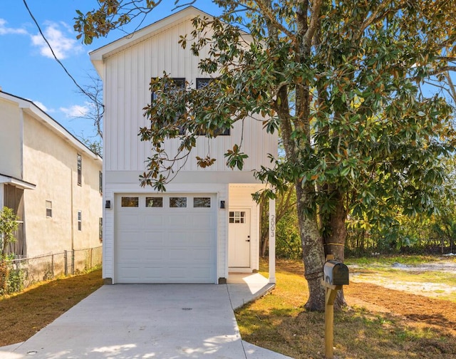 view of front of house featuring board and batten siding and fence