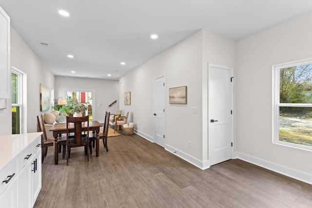 dining room featuring recessed lighting, visible vents, baseboards, and wood finished floors