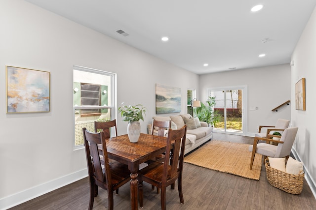 dining space featuring visible vents, baseboards, dark wood finished floors, and recessed lighting