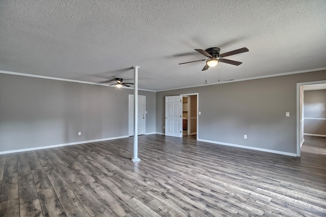 spare room featuring baseboards, crown molding, a ceiling fan, and wood finished floors