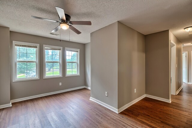 kitchen with a textured ceiling, dishwasher, light hardwood / wood-style floors, tasteful backsplash, and black refrigerator