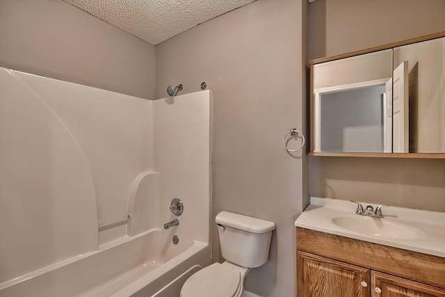 full bath with toilet, tub / shower combination, a textured ceiling, and vanity