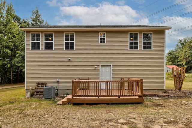 back of house with a yard, central AC, and a wooden deck