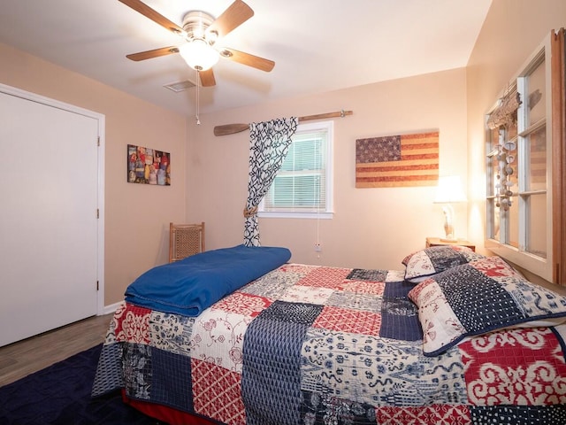 bedroom featuring ceiling fan and wood-type flooring