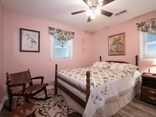 bedroom featuring ceiling fan and hardwood / wood-style flooring