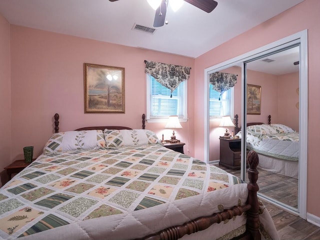 bedroom featuring ceiling fan, a closet, and hardwood / wood-style flooring