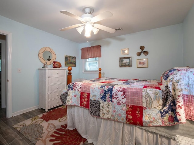 bedroom with ceiling fan and dark hardwood / wood-style flooring