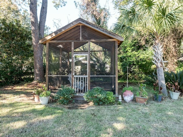 view of outdoor structure with a lawn