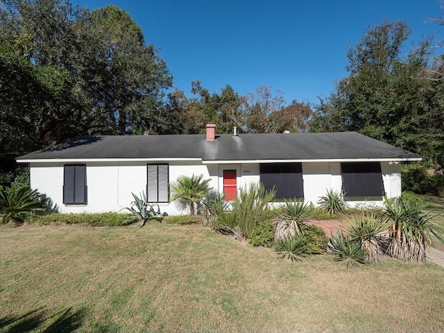 ranch-style house with a front lawn