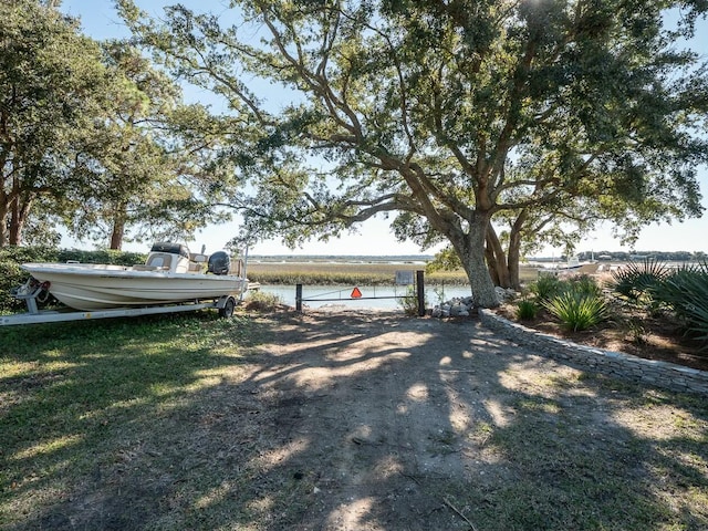 view of front of house with a water view