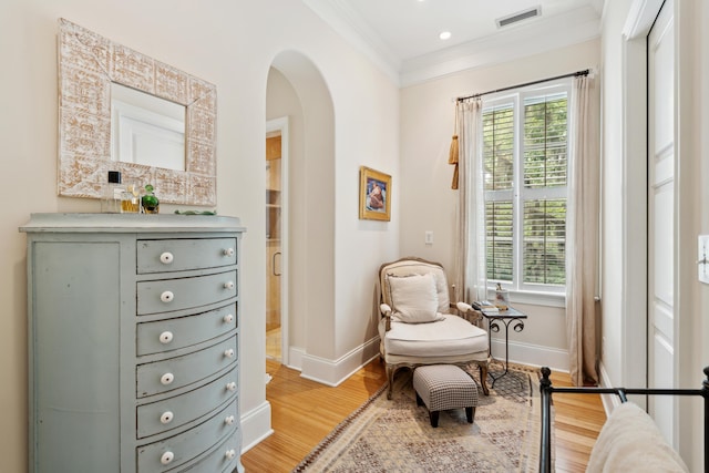 1612 John Fenwick Ln, Johns Island, SC 29455 - living area with arched walkways, ornamental molding, light wood-type flooring, and recessed lighting