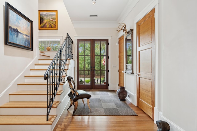 1612 John Fenwick Ln, Johns Island, SC 29455 - entrance foyer with stairs, french doors, wood finished floors, and crown molding