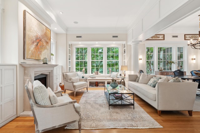 1612 John Fenwick Ln, Johns Island, SC 29455 - living area with a chandelier, a premium fireplace, ornamental molding, light wood-style floors, and recessed lighting