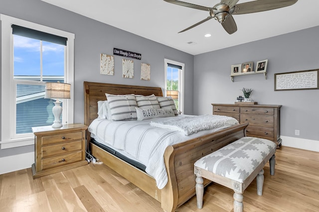 bedroom featuring ceiling fan and light hardwood / wood-style flooring