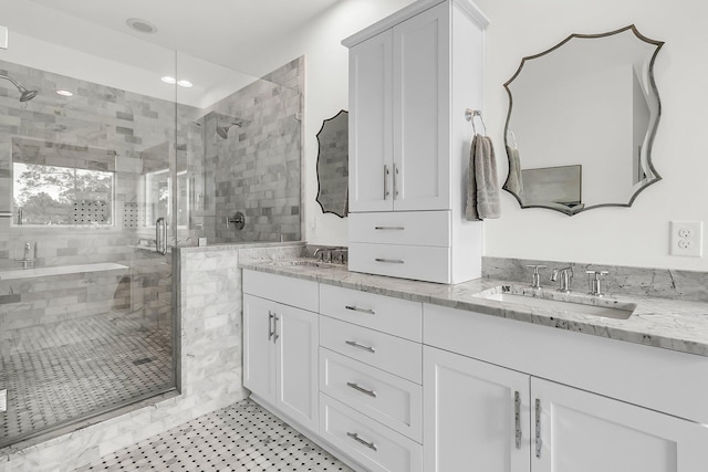 bathroom featuring vanity and a shower with shower door