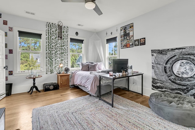 bedroom with hardwood / wood-style flooring and ceiling fan