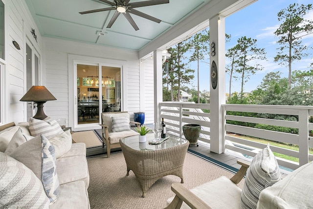 sunroom / solarium featuring ceiling fan