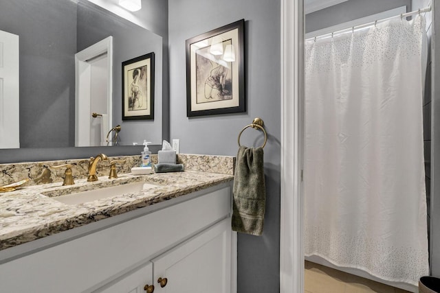 full bathroom featuring vanity and a shower with curtain