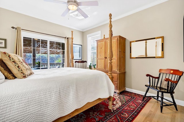 bedroom featuring baseboards, ceiling fan, wood finished floors, and crown molding