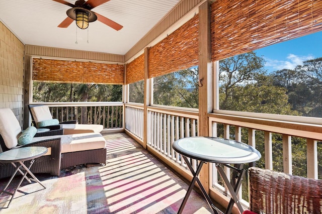 sunroom / solarium with plenty of natural light and ceiling fan