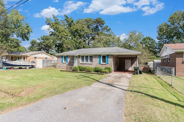 view of front of property featuring a front lawn and a carport