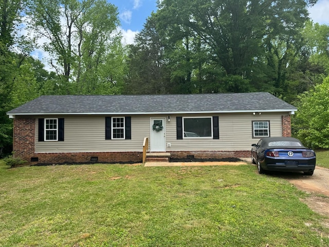 ranch-style home with crawl space, a front lawn, and roof with shingles