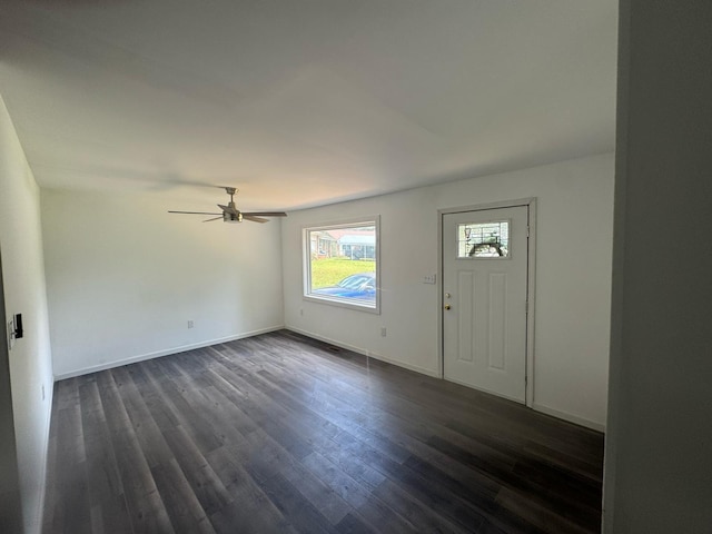 foyer featuring dark wood-style floors, a ceiling fan, and baseboards