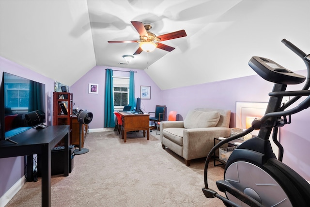 office featuring lofted ceiling, ceiling fan, light colored carpet, visible vents, and baseboards