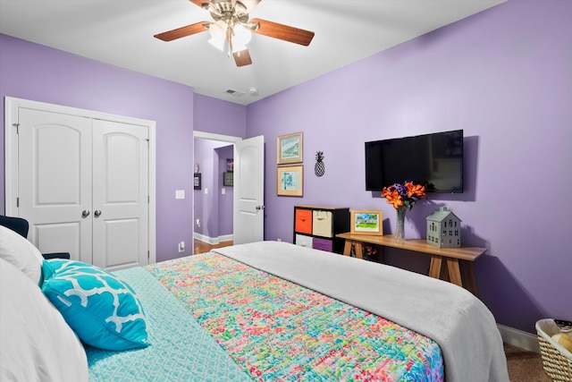 bedroom featuring a closet, visible vents, ceiling fan, and baseboards