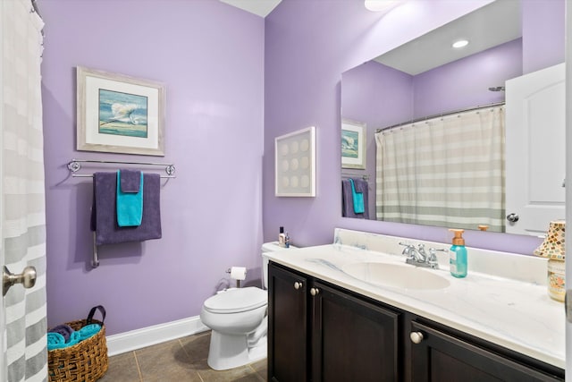 bathroom featuring curtained shower, tile patterned flooring, toilet, vanity, and baseboards